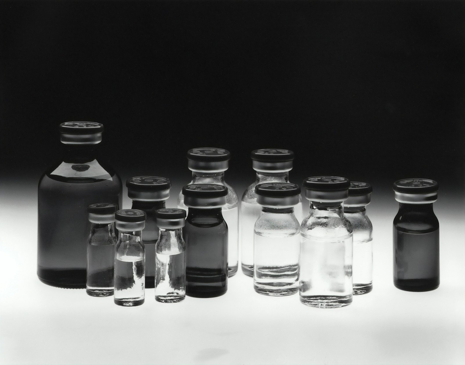 Glass vials in black and white
